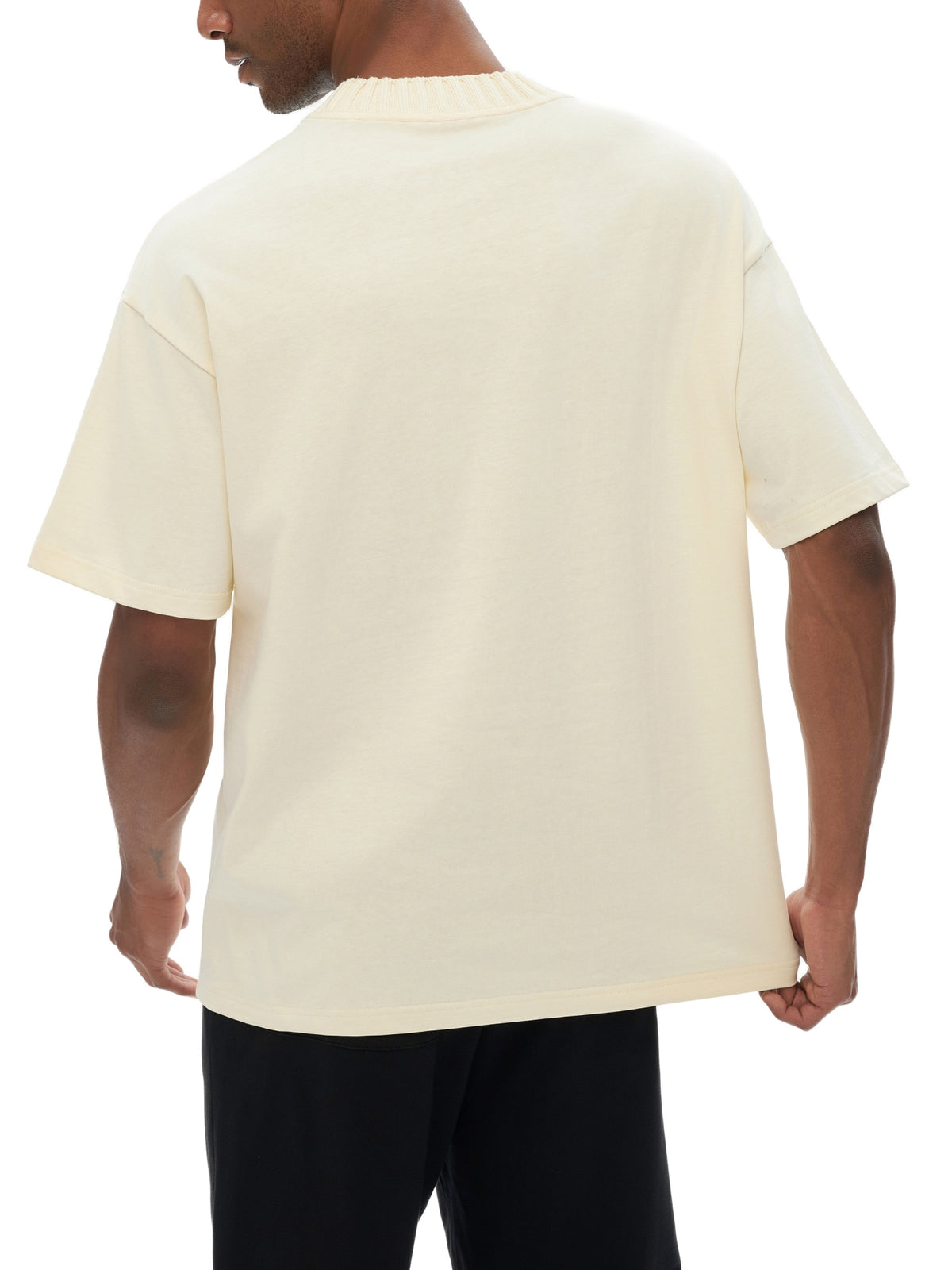 Unisex heavyweight knitted crewneck T-shirt in Apricot – back fit view
