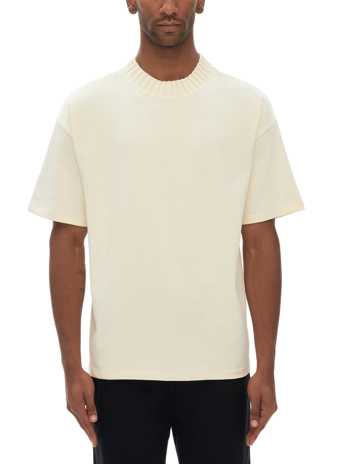 Unisex heavyweight knitted crewneck T-shirt in Apricot – front model view