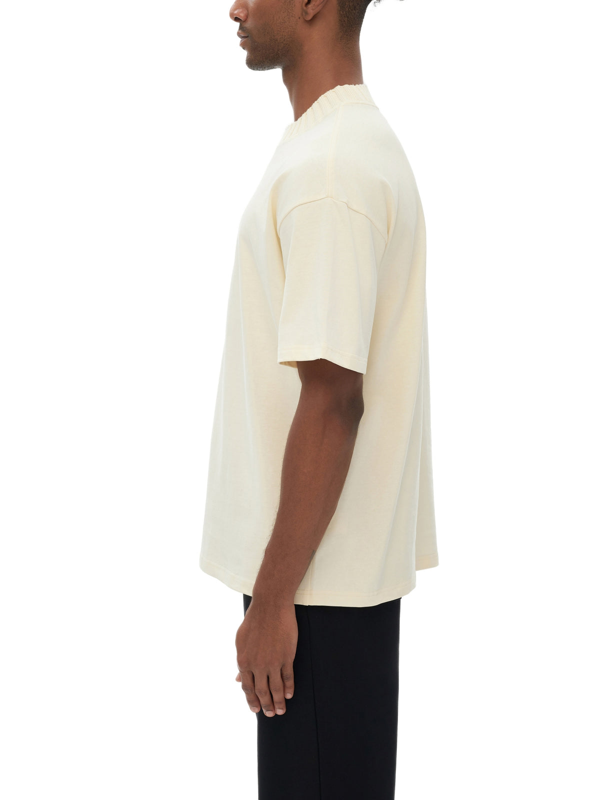 Unisex heavyweight knitted crewneck T-shirt in Apricot – side model view