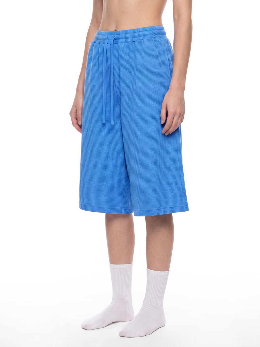 Off Script Unisex Waffle Shorts Colourful Blue model three-quarter view