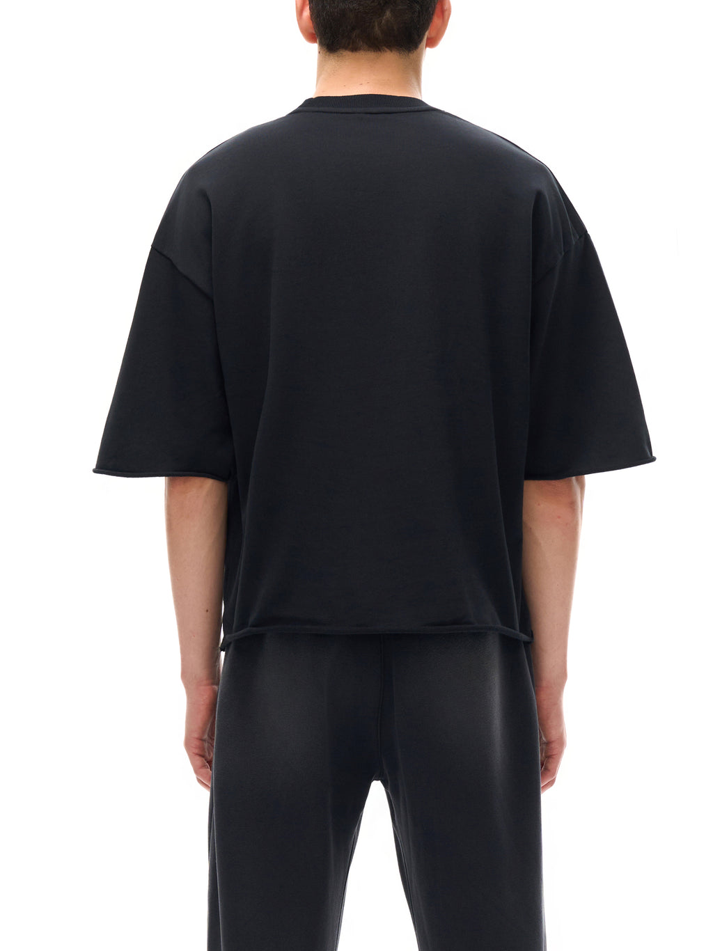 Unisex French Terry Raw-Edge T-Shirt in Black - model back view