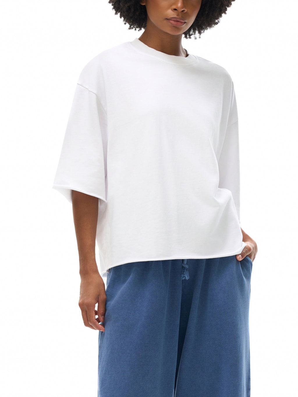 Unisex French Terry Raw-Edge T-Shirt in White - model front pose